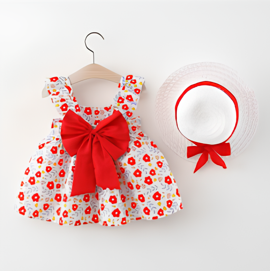 Children's dress with red bow and matching hat on a white background